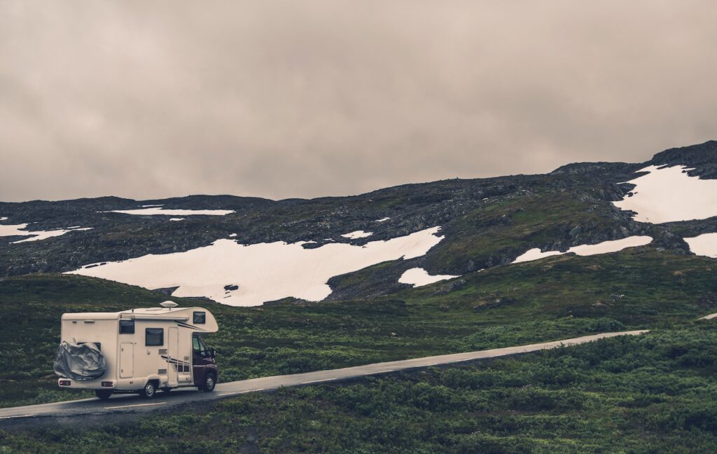 Rv driving in the snowy landscape before going into long-term RV storage